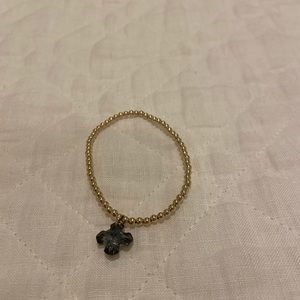 Women’s ENewton gold bracelet with gray cross charm. Never worn